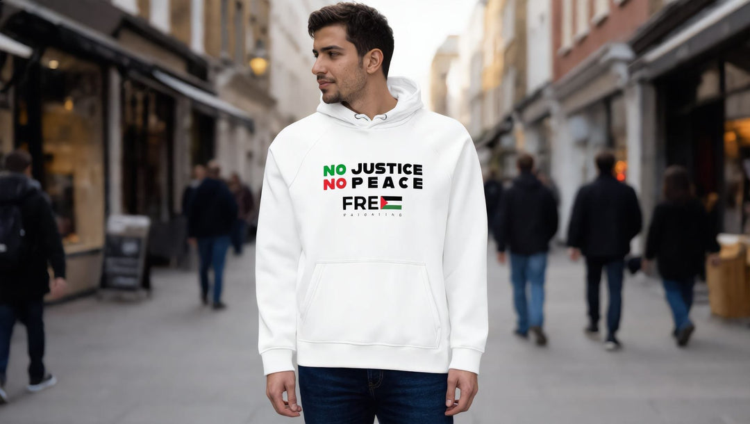 Man wearing a white No Justice No Peace hoodie on Upper Street, Islington, London