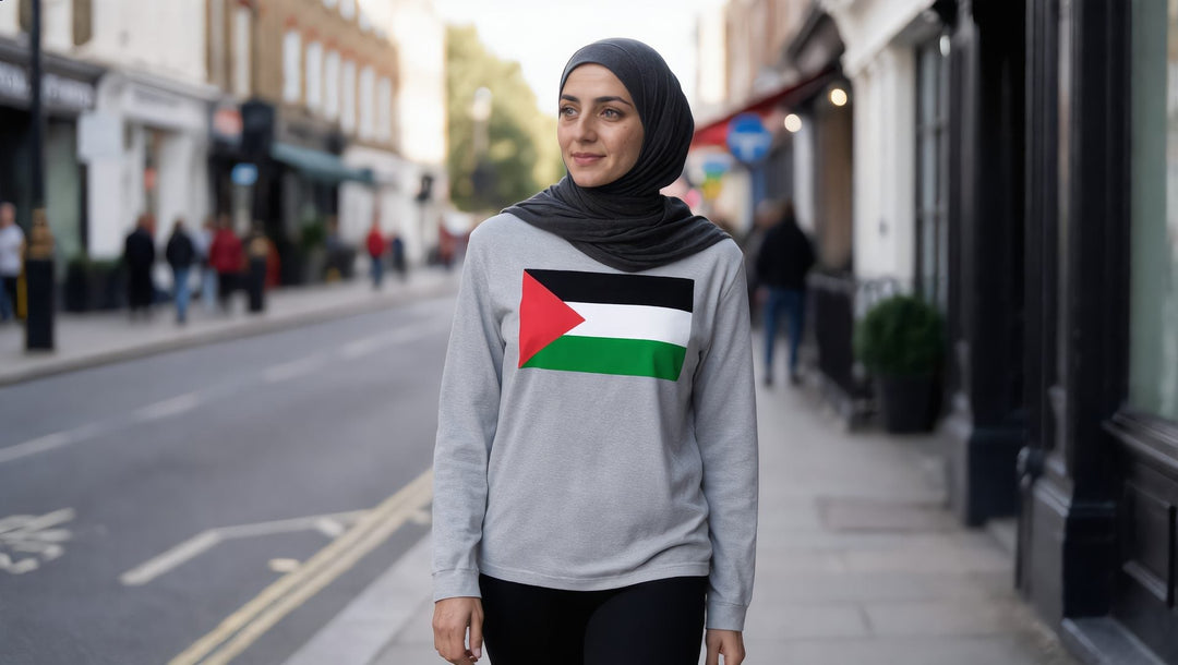 Woman in a grey Palestine flag long sleeve tee on a street in Whitechapel, London