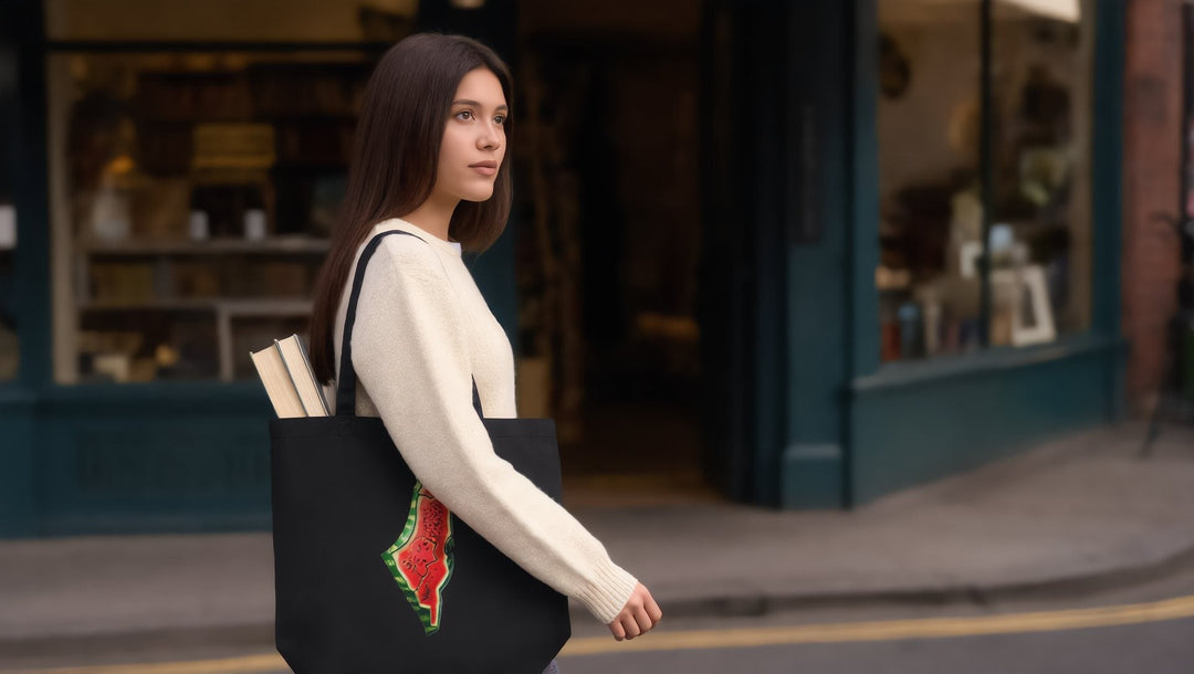 Woman carrying a Palestine watermelon tote with books on Marylebone High Street, London
