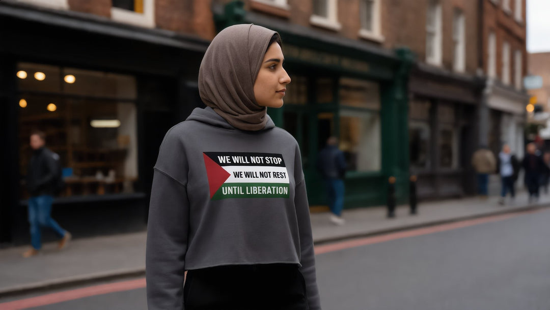 Woman in a We Will Not Stop crop hoodie in Shoreditch, London