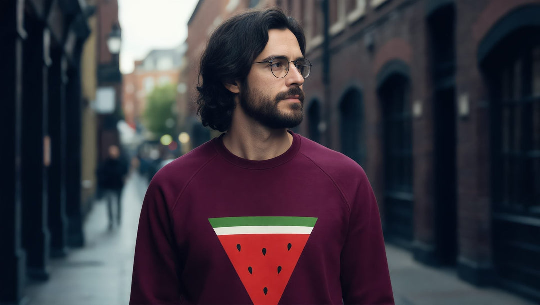Man in a burgundy Triangle Watermelon sweatshirt on Brick Lane in London