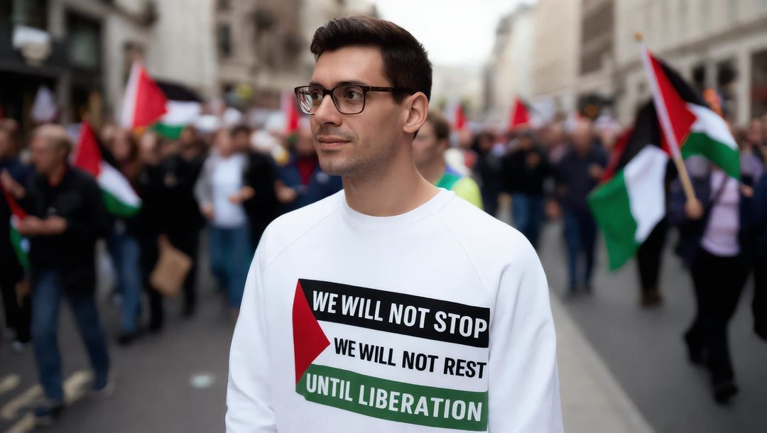 Man in a We Will Not Stop sweatshirt at a march for Palestine in London