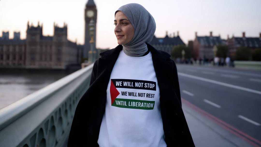 Woman in a We Will Not Stop sweatshirt on Westminster Bridge, London at dusk