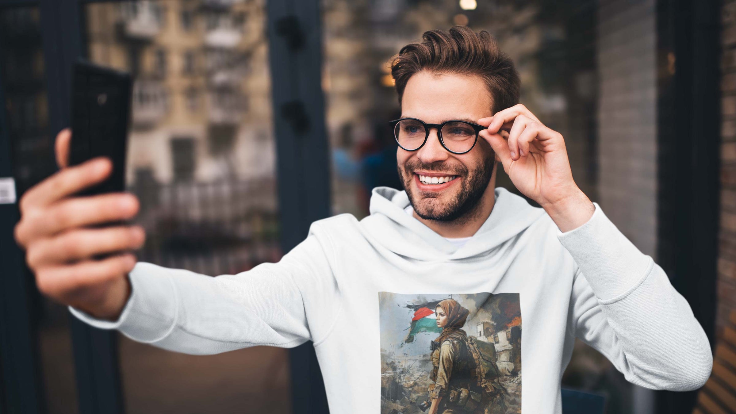 man with hoodie and logo print