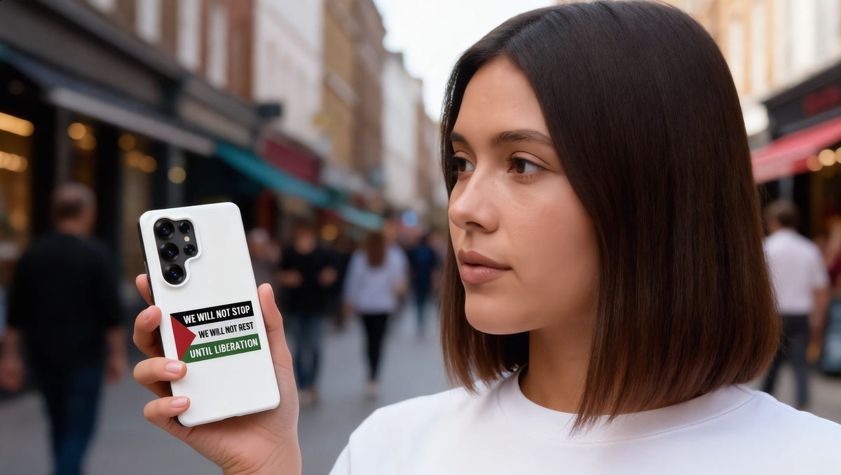 Woman holding a phone in a We Will Not Stop Snap Case for Samsung on King's Road in Chelsea, London