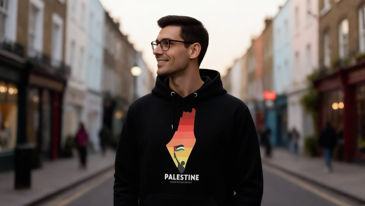 Model wearing a Palestine Map hoodie in sunset colours on a street