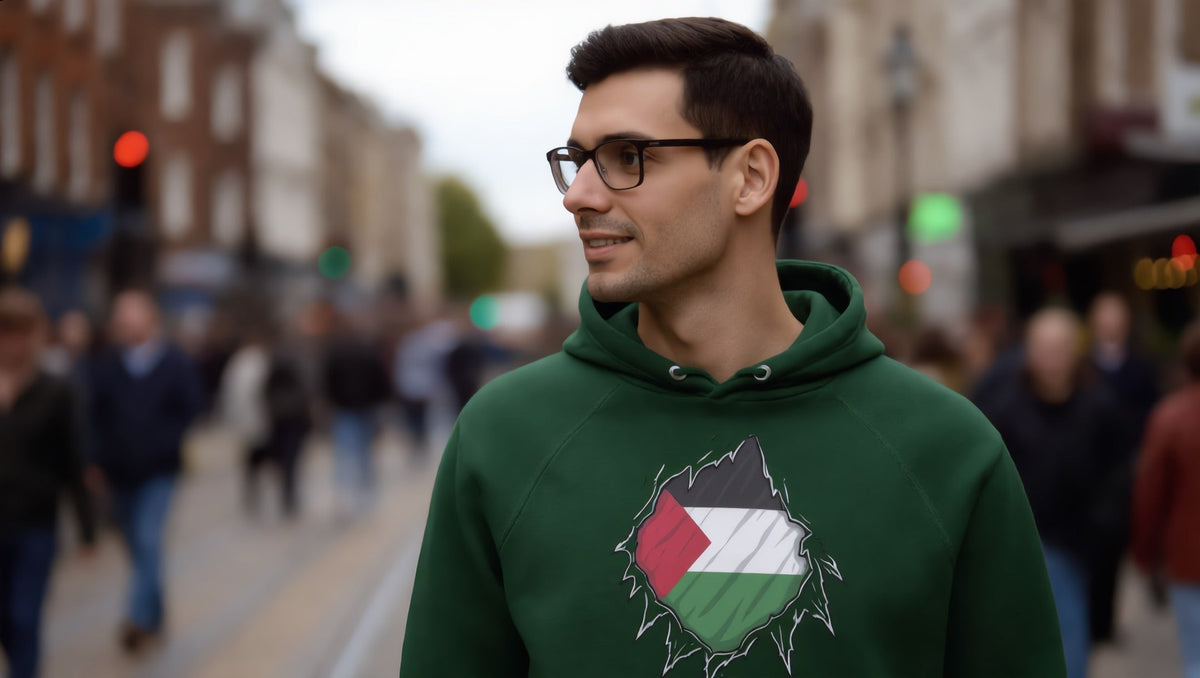 Man wearing a Palestine Hero hoodie on Electric Avenue, Brixton, London