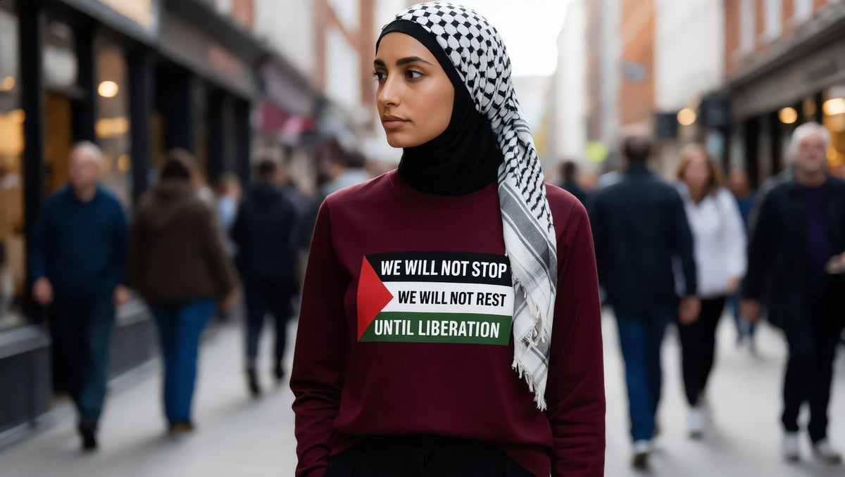 Woman wearing a maroon We Will Not Stop long sleeve tee on Marylebone High Street, London