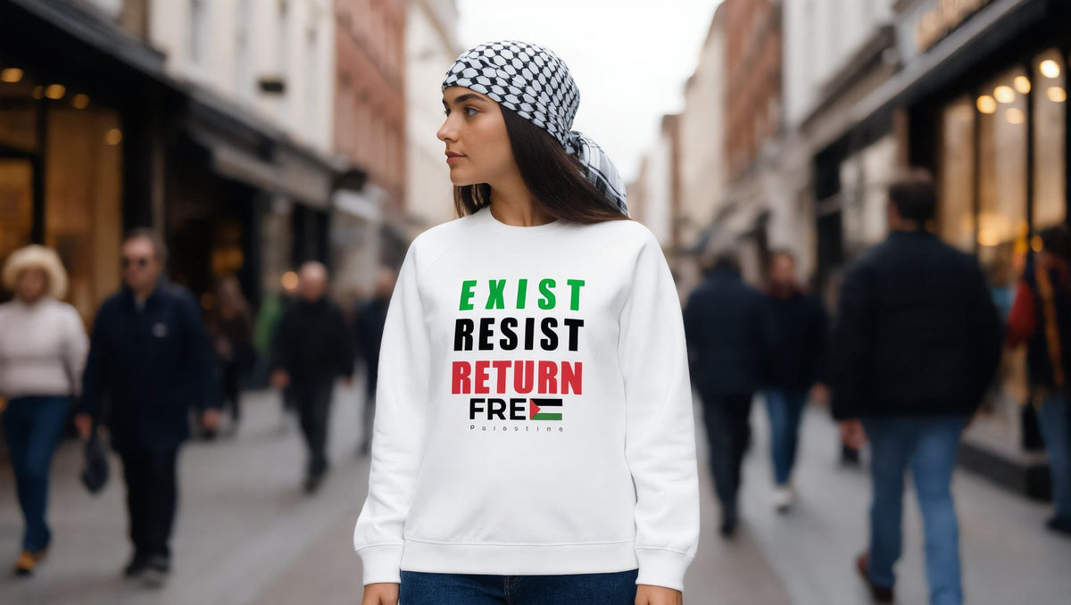 Woman wearing a white Exist Resist Return sweatshirt in Greenwich, London